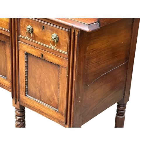 449 - An Early 19th Century, George IV mahogany gallery back sideboard. On turned wrythen legs, 3 drawers ... 