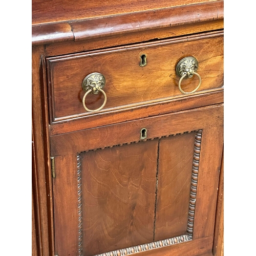 449 - An Early 19th Century, George IV mahogany gallery back sideboard. On turned wrythen legs, 3 drawers ... 