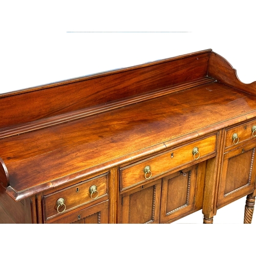 449 - An Early 19th Century, George IV mahogany gallery back sideboard. On turned wrythen legs, 3 drawers ... 