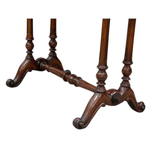 683 - A 19th Century Victorian mahogany side table with stretcher support and cabriole legs. 92x52x66.5cm