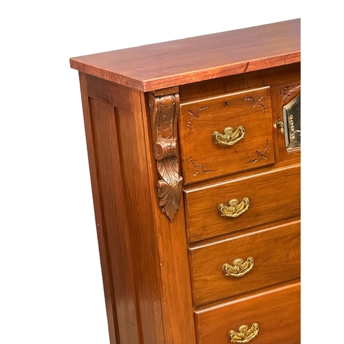 780 - A large 19th Century Victorian mahogany chest of drawers, with bevelled glass panel door. 120x55x126... 