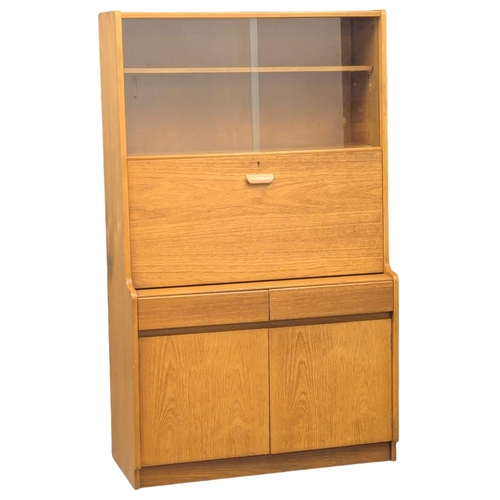 781 - A Mid Century teak bureau display cabinet by Remploy. 91x41x153cm