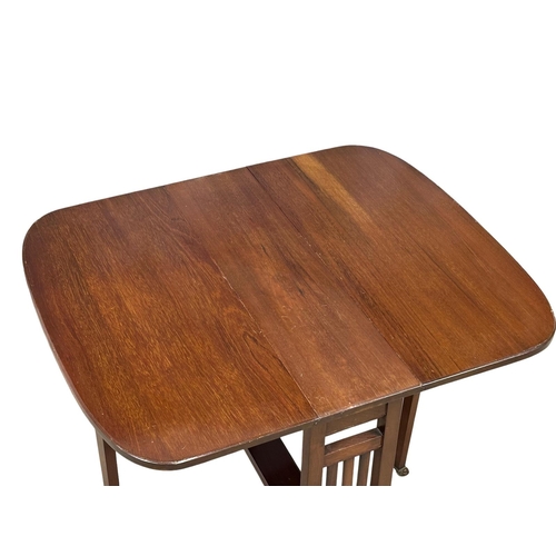 782 - An Edwardian mahogany Sutherland table