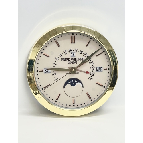 1005 - A Patek Philippe advertising wall clock. 40cm