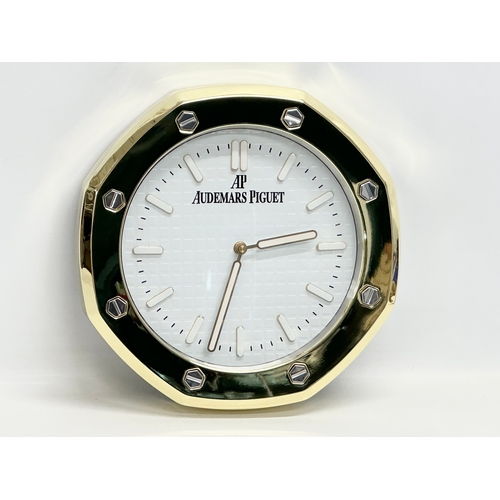 1010 - An AP Audemars Piguet adverting wall clock. 33cm