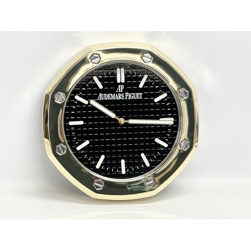 1011 - An AP Audemars Piguet advertising wall clock. 34cm