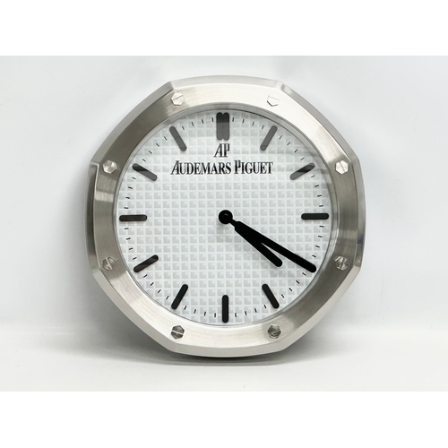 1003 - An AP Audemars Piguet adverting wall clock. 34cm