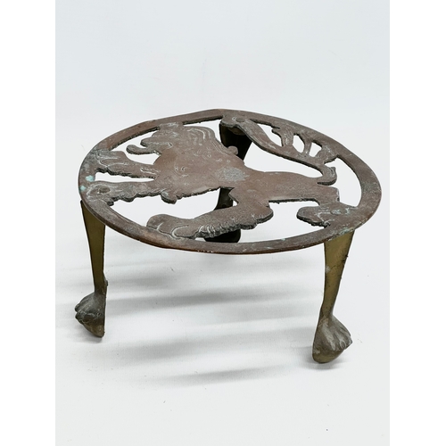 518 - Two Late 19th Century Victorian brass trivet stands.