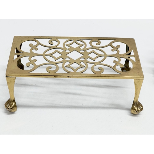 518 - Two Late 19th Century Victorian brass trivet stands.