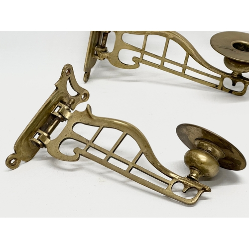 519 - A pair of brass wall sconce candleholders. Circa 1900. 20cm