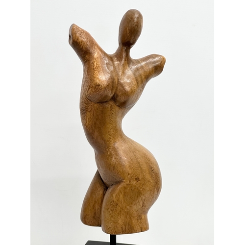 848 - A Late 20th Century carved torso sculpture on stand. 46cm