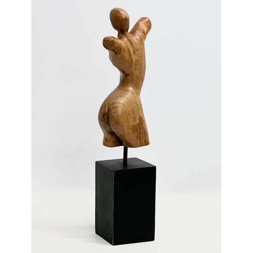 848 - A Late 20th Century carved torso sculpture on stand. 46cm