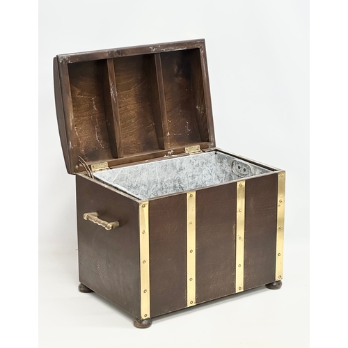 508 - A Mid 20th Century oak and brass bound dome top coal bin/log box. 52x32x39cm