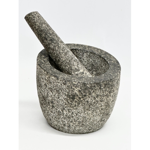 546 - A yew wood and granite mortar & pestles. 15x13cm. 12x9cm