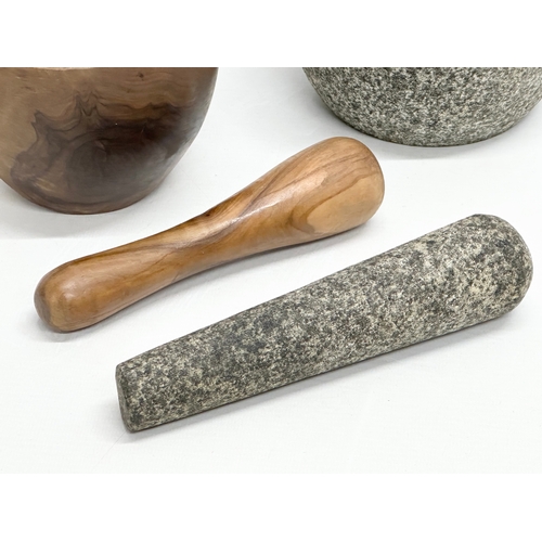 546 - A yew wood and granite mortar & pestles. 15x13cm. 12x9cm