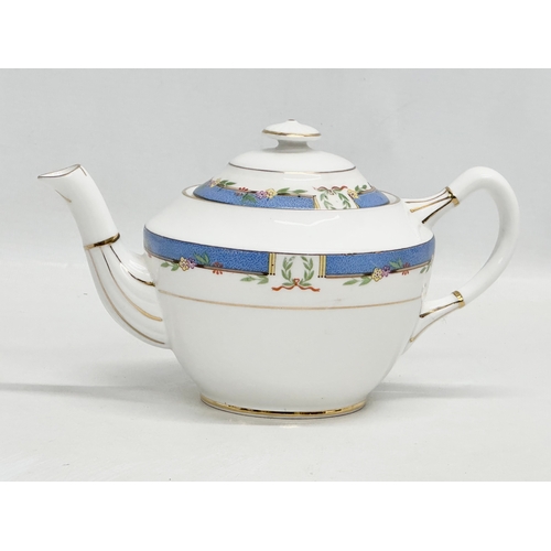 850 - A Royal Albert “Orient” teapot and 3 decorative porcelain tea spoons.