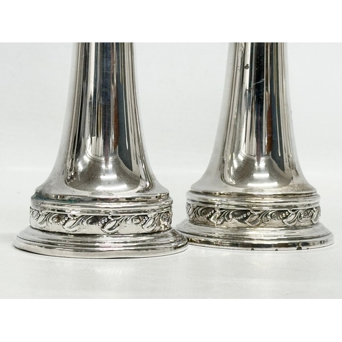 590 - A pair of large silver condiments/salt and pepper shakers. Stamped Sterling. 193g. 14cm