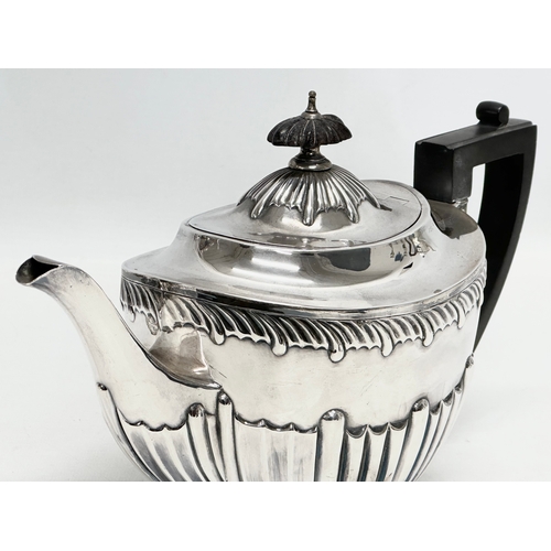 592 - L.A.W. A Late 19th Century silver teapot. London, 1895. 540.5g. 28x11x18cm