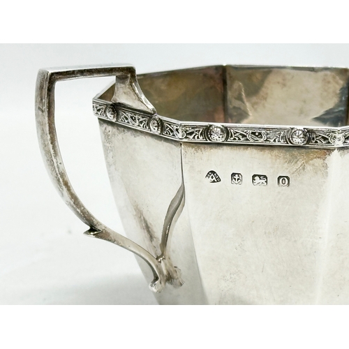 593 - A Early 20th Century silver sugar bowl. Birmingham, 1938. 165.5g. A. Bros LTD. 14.5x9.5x8cm