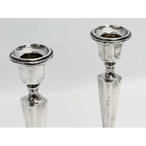 595 - A pair of Early 20th Century silver candlesticks. Birmingham, 1938. Filled. Sydney & Co. 20.5cm