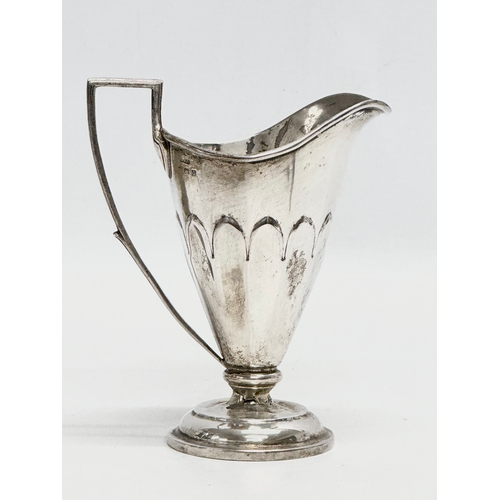 602 - An Early 20th Century silver cream jug. Birmingham. 83g. Gorham Mfg.