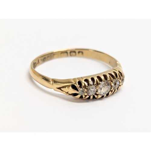 621 - An 18ct gold ring with 5 diamonds. Total weight 2.5g. UK size P.