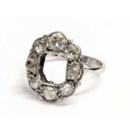 650 - A platinum ring with 8 diamonds. Total weight 4g. UK size N