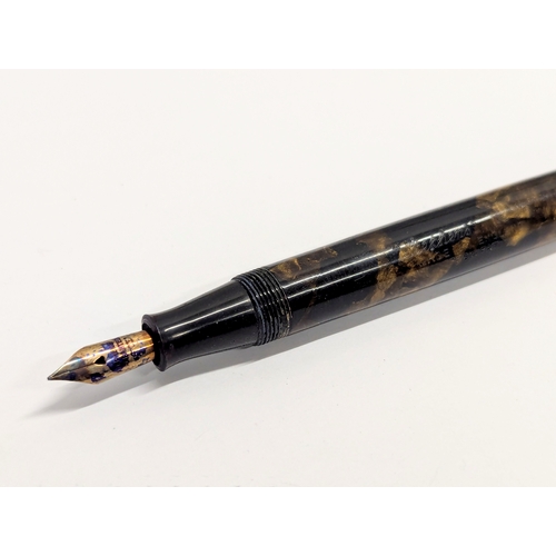 660 - A 14ct gold nib fountain pen