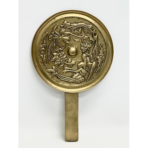 372 - A Chinese, Qing Dynasty 19th Century bronze hand mirror. 18x29cm