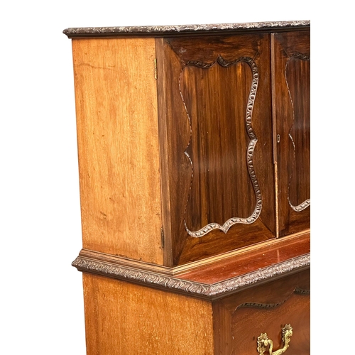 396 - An Early 20th Century Chippendale Revival mahogany secretaire cabinet, with pigeon hole shelves and ... 