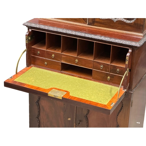 396 - An Early 20th Century Chippendale Revival mahogany secretaire cabinet, with pigeon hole shelves and ... 