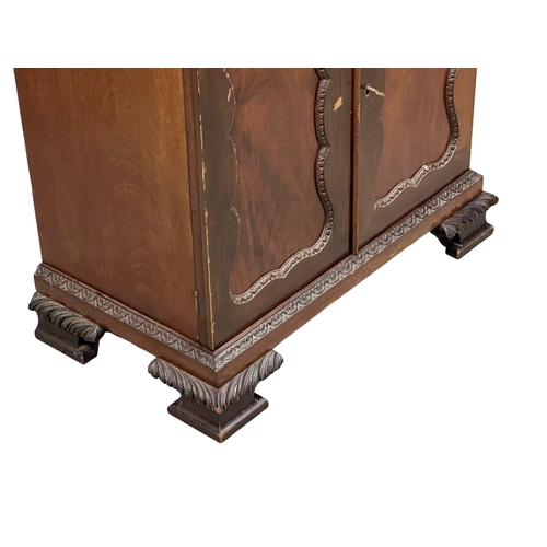 396 - An Early 20th Century Chippendale Revival mahogany secretaire cabinet, with pigeon hole shelves and ... 