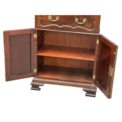 396 - An Early 20th Century Chippendale Revival mahogany secretaire cabinet, with pigeon hole shelves and ... 