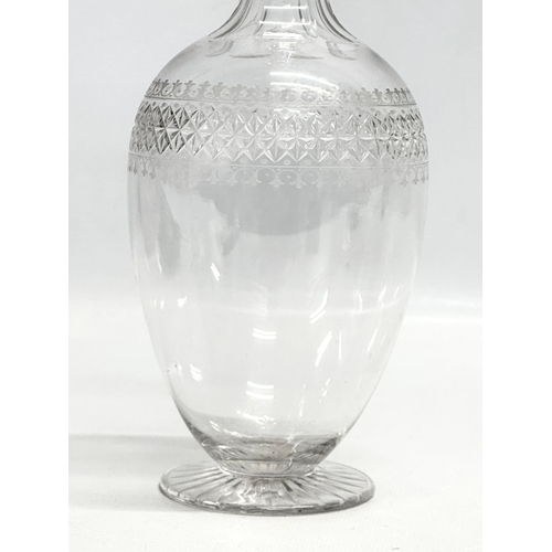 451 - A fine quality 19th Century etched and star cut decanter. Mid/Late 19th Century. 29cm