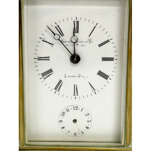 386 - Howell James & Co. A Late 19th Century brass carriage clock with 5 bevelled glass panels and key. 9x... 