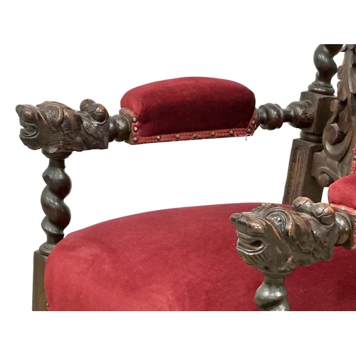 580 - A large Late 19th Century Jacobean Revival oak high back armchair with large carved lion head arms. ... 