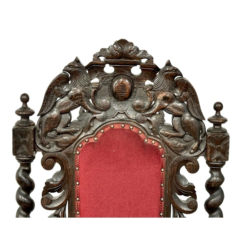 580 - A large Late 19th Century Jacobean Revival oak high back armchair with large carved lion head arms. ... 