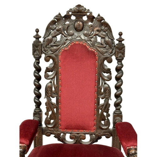 580 - A large Late 19th Century Jacobean Revival oak high back armchair with large carved lion head arms. ... 