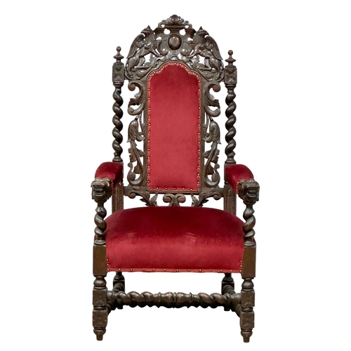 580 - A large Late 19th Century Jacobean Revival oak high back armchair with large carved lion head arms. ... 