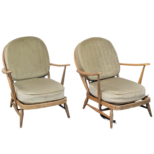 577 - A pair of Ercol Mid Century elm and beech armchairs