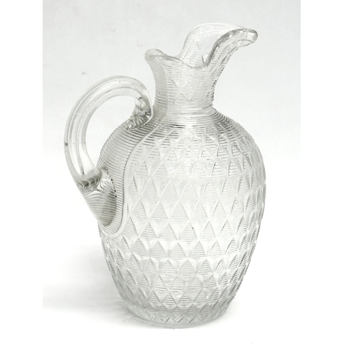 872 - Two 19th Century glass jugs. 13cm. 10cm.