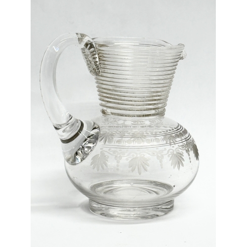 872 - Two 19th Century glass jugs. 13cm. 10cm.