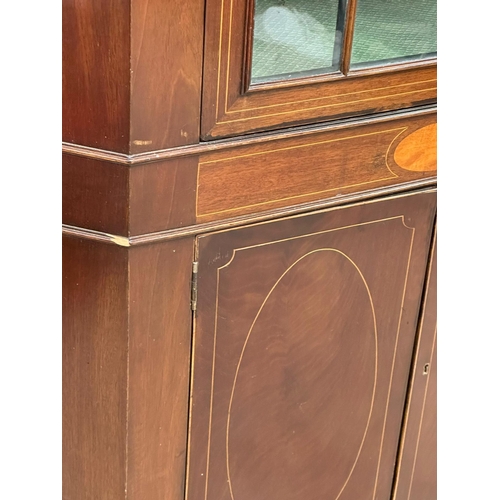 846 - A Mid/Late 19th Century Sheraton Revival inlaid mahogany corner cabinet in the George III style. Cir... 