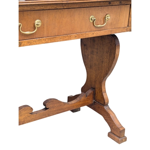 892 - A Late 19th Century North European walnut sofa table on stretcher base. With 1 drawer and dummy draw... 