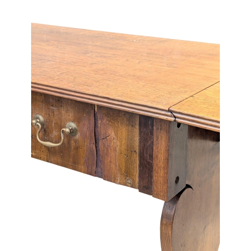 892 - A Late 19th Century North European walnut sofa table on stretcher base. With 1 drawer and dummy draw... 