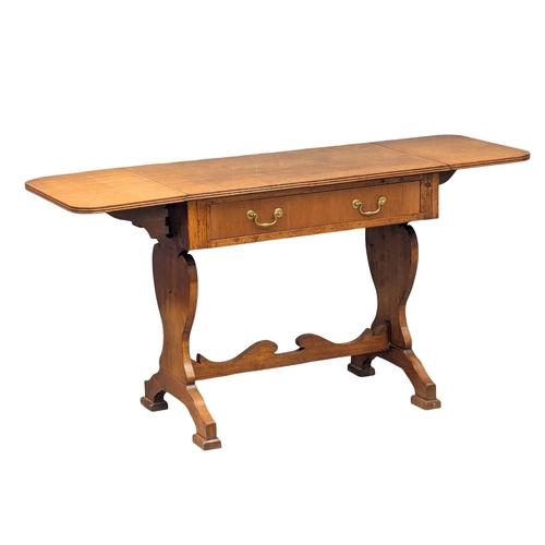 892 - A Late 19th Century North European walnut sofa table on stretcher base. With 1 drawer and dummy draw... 