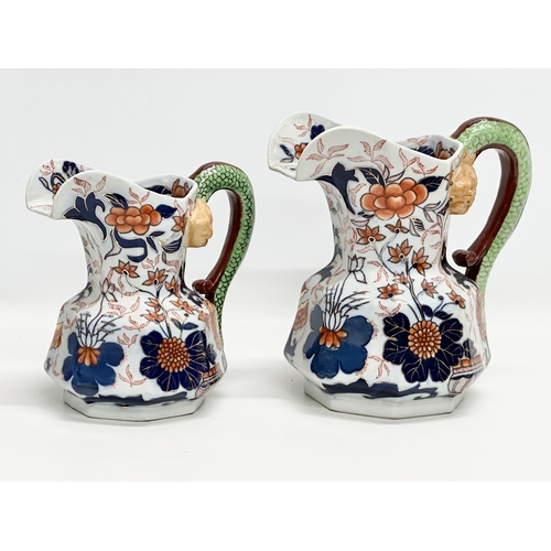 894 - A collection of 19th Century Ironstone China Imari jugs with serpent handles. 24x24.5cm. 20x21cm. 17... 