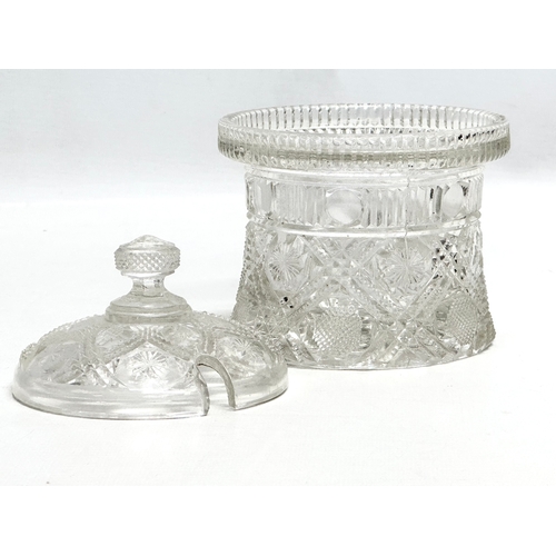 898 - A 19th Century American moulded glass jam pot with cover. 11x14cm