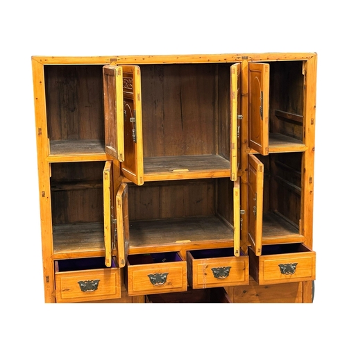 379 - A large 20th Century Chinese multi cupboard cabinet, with 5 drawers. 140x57x181.5cm.