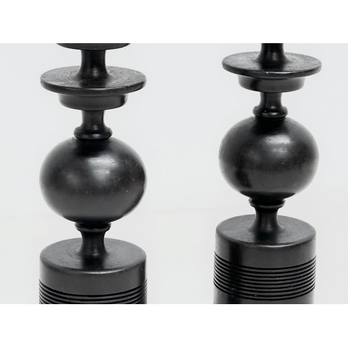 380 - A pair of Early/Mid 20th Century turned ebony candlesticks. 23.5cm